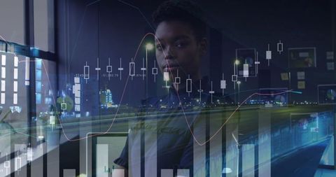 Focused Woman Analyzing Financial Charts at Night in Urban Setting