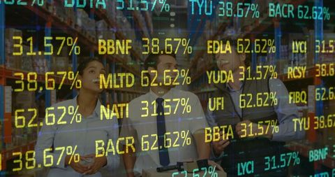 Diverse warehouse supervisors analyzing stock market data