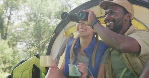 Happy Couple Camping and Spotting Birds in Sunny Park