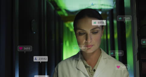 Engineer Analyzing Data in High-Tech Server Room with Social Media Icons