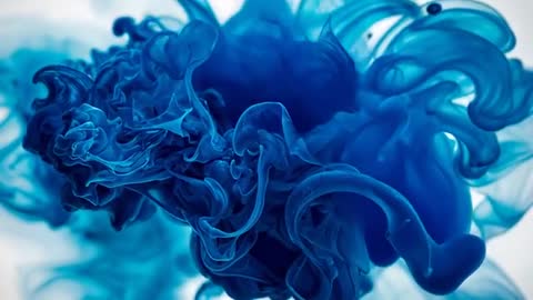Vibrant Cobalt Blue Ink In Water Creating Ethereal Swirls