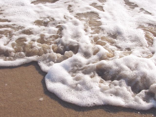 Gentle Ocean Waves Touching Sandy Shore - Download Free Stock Photos Pikwizard.com