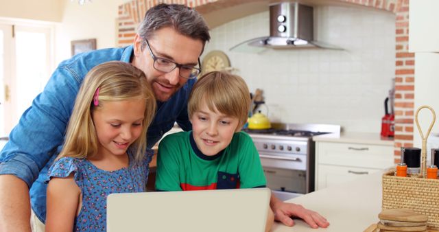 Father Spending Quality Time with Children Using Laptop in Kitchen - Download Free Stock Images Pikwizard.com