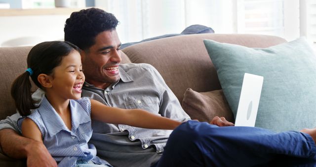 Happy Father and Daughter Using Laptop on Couch - Download Free Stock Images Pikwizard.com