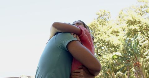 Fun Romantic Moment: Young Woman Playfully Holding Partner's Hand