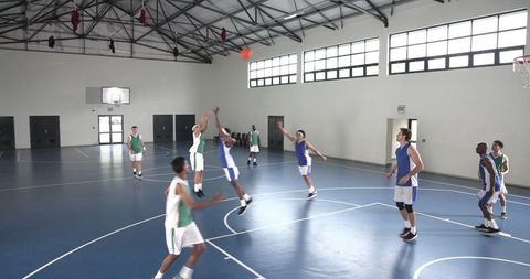 Energetic basketball play in indoor game setting