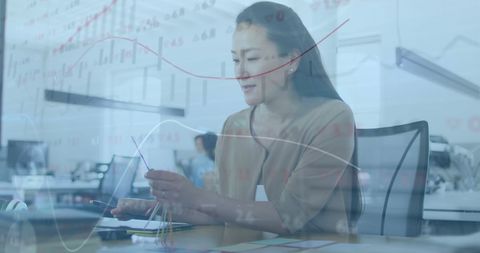 Woman Analyzing Financial Data with Futuristic Virtual Interface