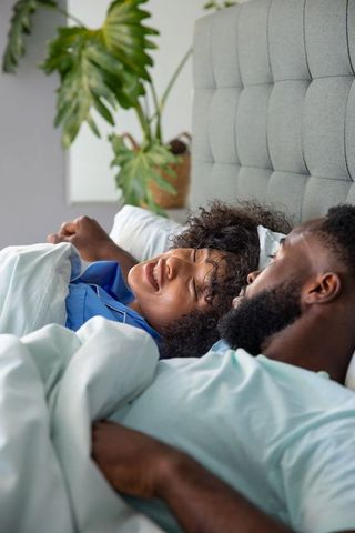 Couple Relaxing in Cozy Bedroom with Modern Decor