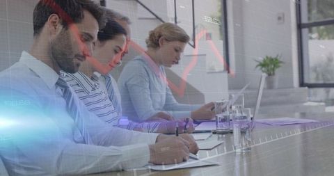 Professionals Taking Notes with Economic Data Overlay