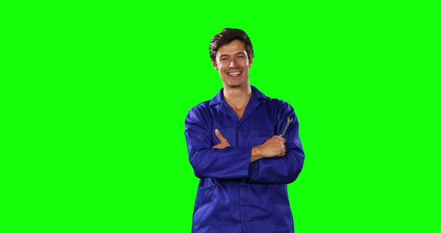 Smiling Male Mechanic Holding Tool on Green Screen Background - Download Free Stock Images Pikwizard.com