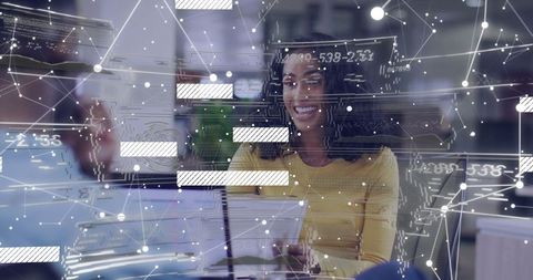 Smiling professional collaborating in modern tech environment