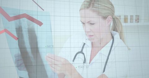 Female Doctor Analyzing X-ray with Digital Data Interface