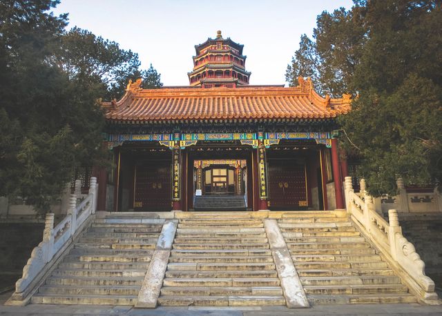 Capturing the beauty of a secluded entrance to a traditional Chinese temple, this scene showcases intricate architectural details and a tranquil setting. Ideal for promoting tourism, cultural heritage, and historical education, the image evokes the serene and ancient atmosphere of Chinese pagodas and temples.