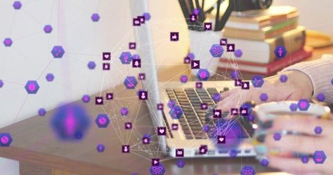 Typing Hands on Laptop with Purple Network Overlay Connecting Social Media and Data