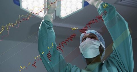 Surgeon adjusting overhead led lamp while financial market charts overlay operating room