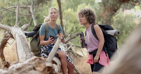 Two Young Women Hiking and Exploring Nature Together - Download Free Stock Images Pikwizard.com