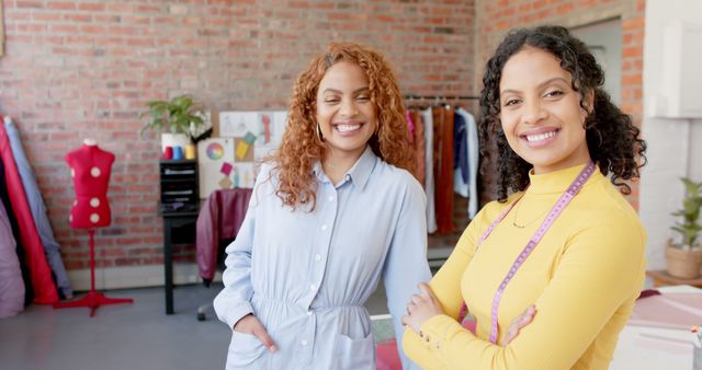 Two Smiling Female Fashion Designers in Studio - Download Free Stock Images Pikwizard.com