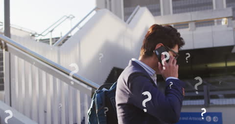 Confused Businessman on Phone with Overlayed Question Marks