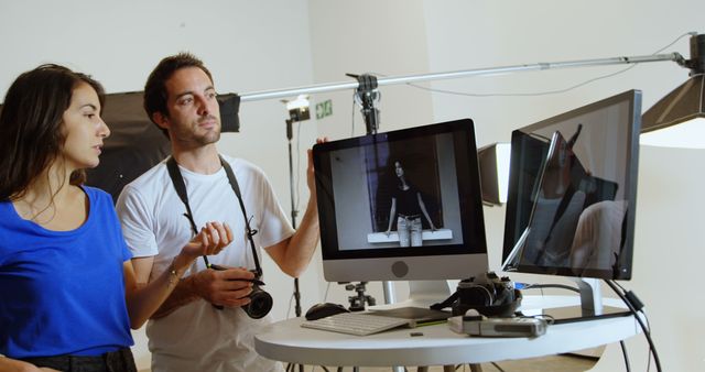 Photographer and Assistant Reviewing Shots on Monitor During Photoshoot - Download Free Stock Images Pikwizard.com