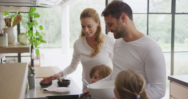 Happy Caucasian Family Making Pancakes for Breakfast in Modern Kitchen - Download Free Stock Images Pikwizard.com