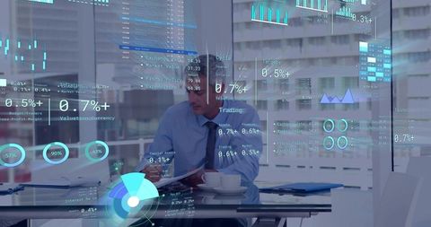 Executive reviewing financial dashboards on transparent ar display in modern office