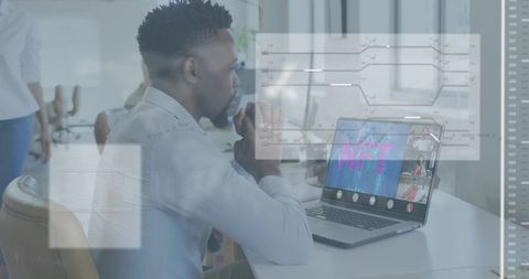 Businessman Leaning at Desk Studying NFT Video Meeting on Laptop with Digital Interface Overlays