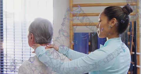Female Physiotherapist Guiding Senior Man Neck Mobilization Manual Therapy in Sunlit Clinic