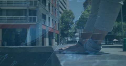Pressing forearms on concrete ledge doing street pushup workout in urban plaza outdoors