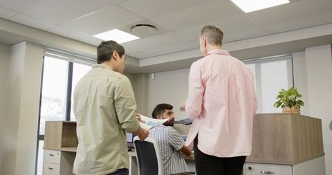 Diverse Coworkers Collaborating on Business Project in Office Setting