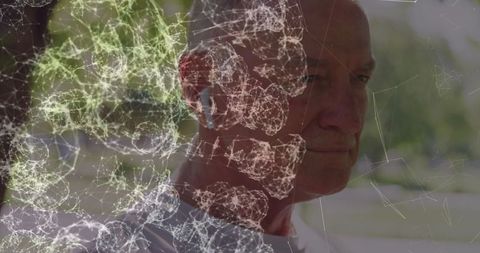 Mature Man Engaging with Advanced Technology Network