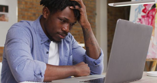 Frustrated man working on laptop in home office - Download Free Stock Images Pikwizard.com