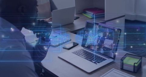 Business professional reviewing remote presentation on laptop with digital data overlay