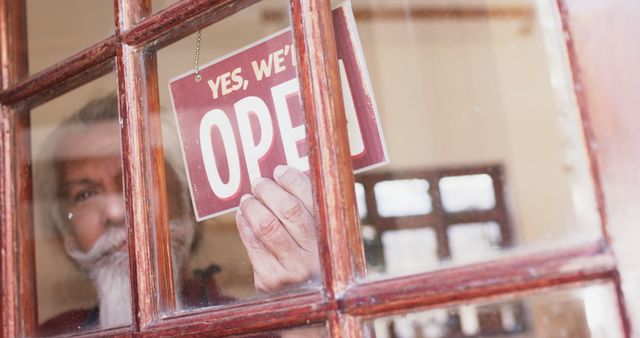 Senior Man Placing Open Sign on Glass Door of Small Business - Download Free Stock Images Pikwizard.com