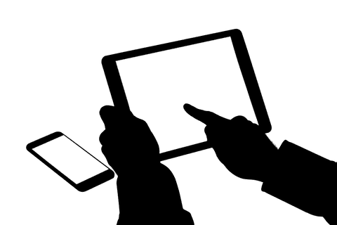 Digital tablet hand silhouette isolated on transparent background