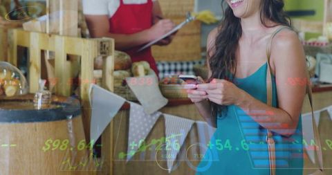 Smiling woman using smartphone while shopping at rustic bakery market stall