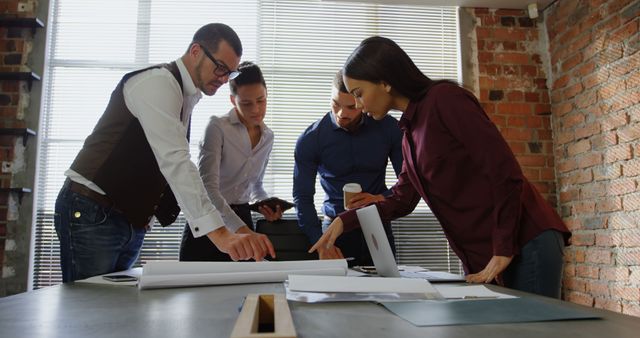 Team Collaborating on Project in Modern Office with Exposed Brick Walls - Download Free Stock Images Pikwizard.com