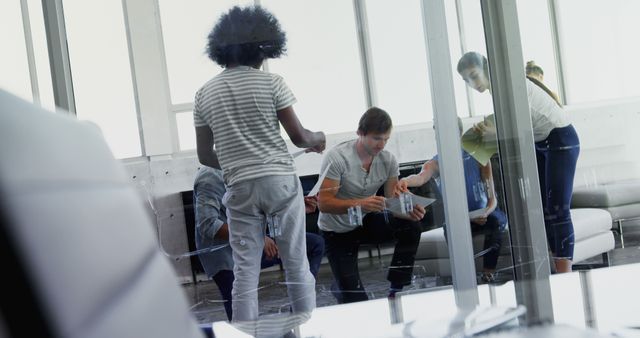 Team brainstorming in modern office with glass walls - Download Free Stock Images Pikwizard.com