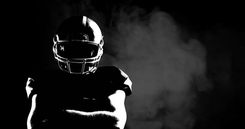 American Football Player in Dramatic Spotlight with Smoke - Download Free Stock Images Pikwizard.com