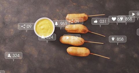 Viral corn dogs with social media engagement icons
