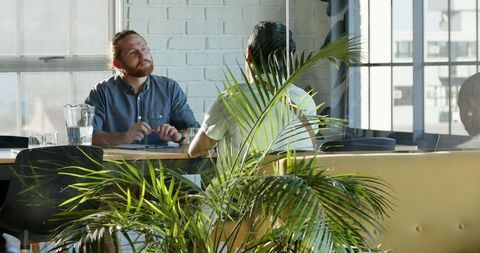 Business Team Meeting: Brainstorming in Modern Office