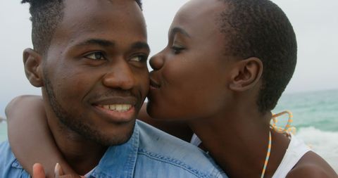 Joyful Couple at Beach Enjoying Memorable Time