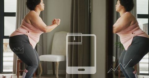 Woman squatting during home workout with smart mirror interface and fitness data overlay