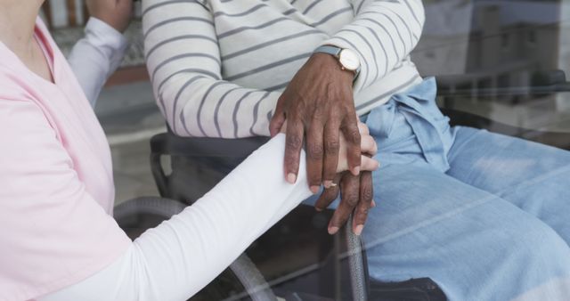 Supportive Nurse Holding Hand of Elderly Patient in Wheelchair - Download Free Stock Images Pikwizard.com