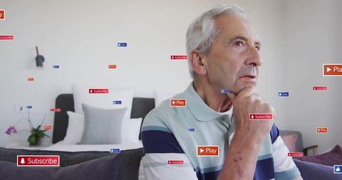 Senior man sitting on sofa surrounded by floating subscribe play like icons, contemplating