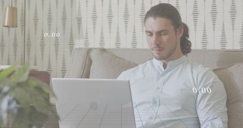 Working adult male typing on laptop on sofa with digital overlay, modern cozy home workspace