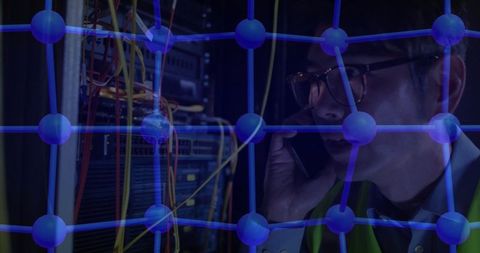 Technician Managing Network Nodes in Server Room