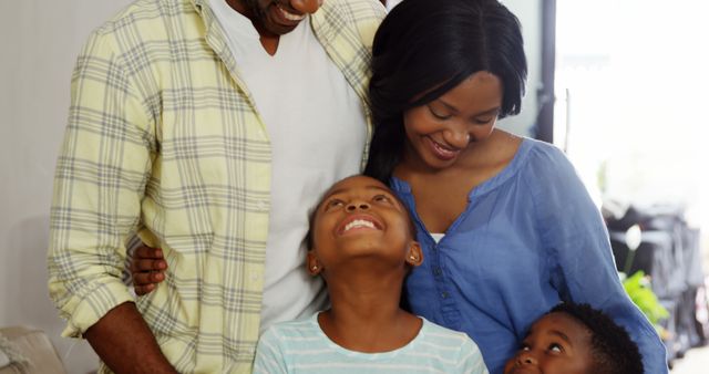 Happy Family Bonding Indoors with Parents and Children Smiling - Download Free Stock Images Pikwizard.com