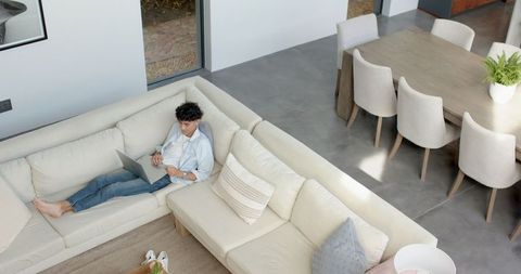 Man Enjoying Lounge Time in Stylish Contemporary Living Room