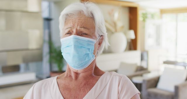 Senior woman wearing protective face mask indoors - Download Free Stock Images Pikwizard.com