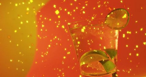 Vibrant Cocktail with Lime and Shimmering Confetti on Festive Background - Download Free Stock Images Pikwizard.com